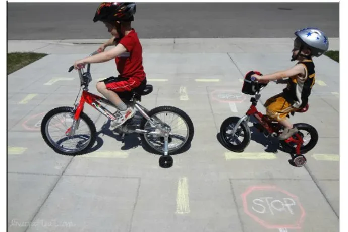 Creating a bike chalk road to teach bike safety right in your driveway