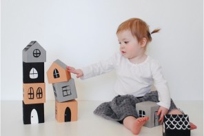 Ways to make old wooden blocks new again, like this painted house craft from Mer Mag