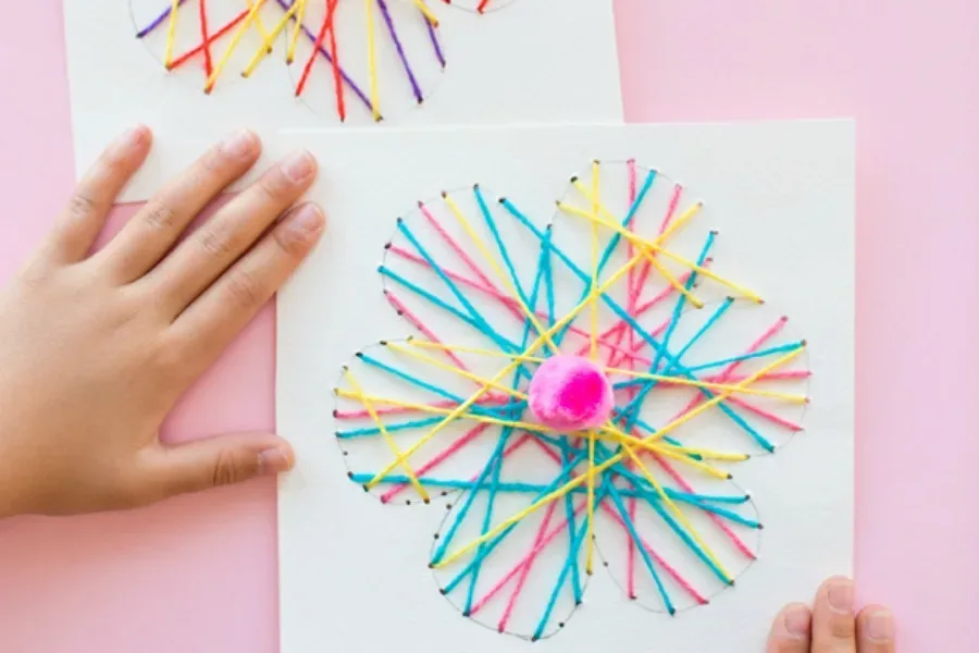 Flower crafts for kids: String Art Flower by Hello, Wonderful