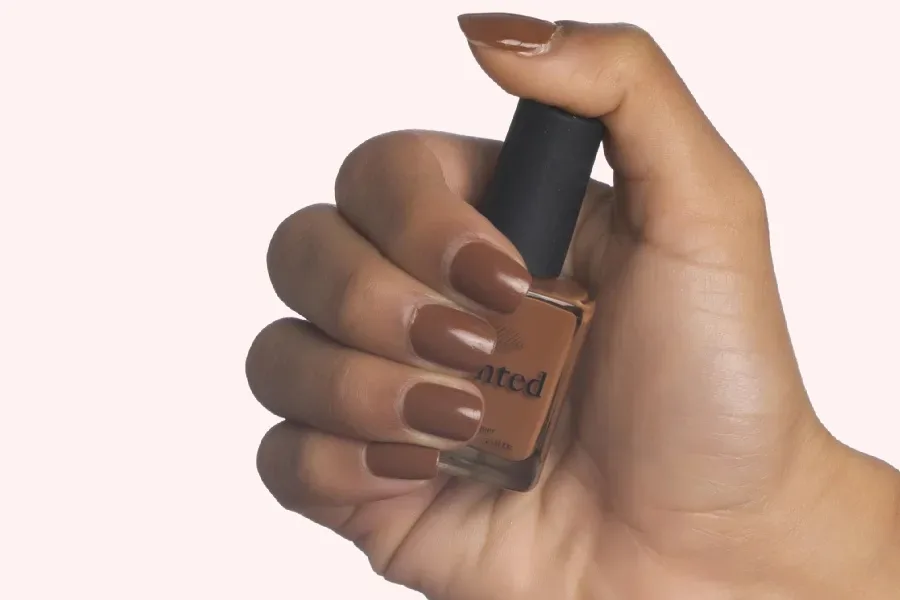 Our Favorite Spring 2022 Nail Trends includes the natural and nude shades for every skin tone, like Mented Brown & Bougie polish