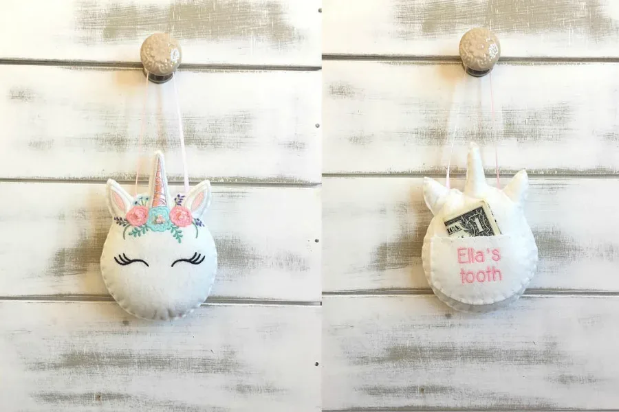 Creative tooth fairy traditions: Using a tooth fairy pillow shaped like a unicorn
