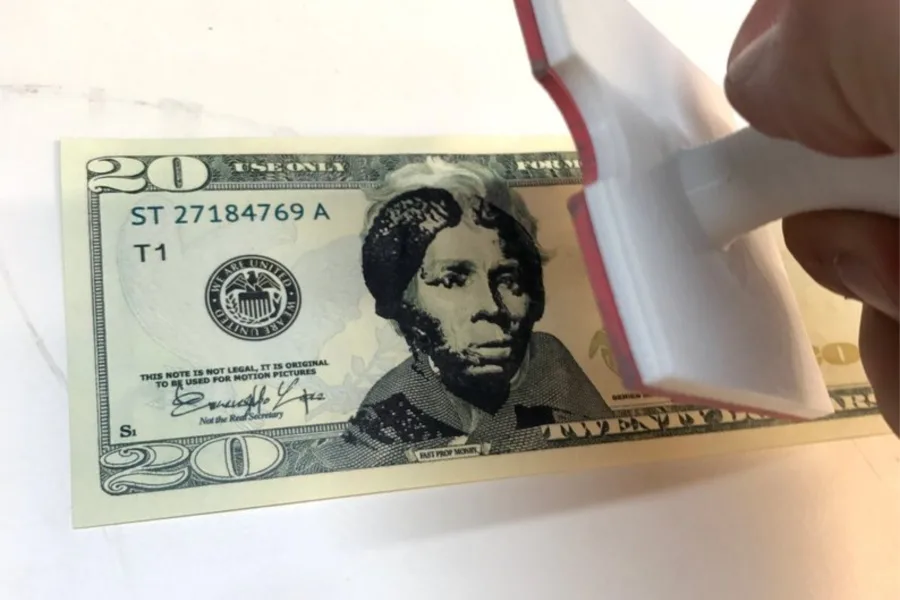 The Harriet Tubman stamp for $20 bills, from Dano Wall. Perfectly legal, and available for sale with donations to great charities