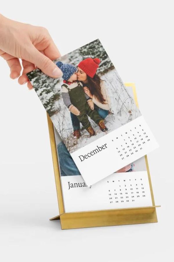 Download your favorite photos to create this brass calendar from Artifact Uprising for your mother in law.