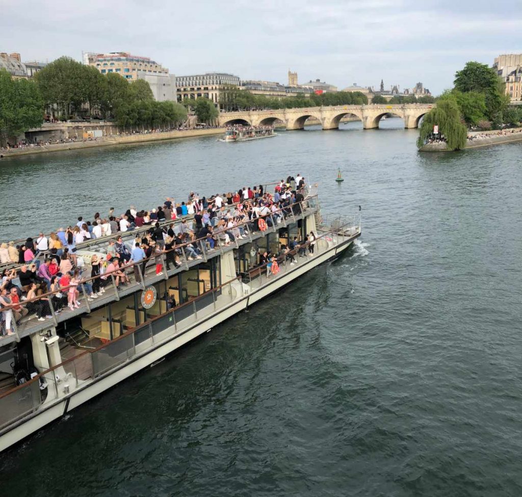 Paris travel with teens: Off the beaten path activities like a boat tour of architectural Paris