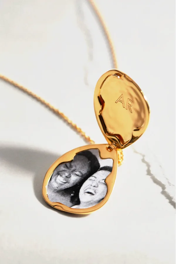 Symbolic jewelry gifts for grads: A keepsake gold and diamond compass cham from Gorjana