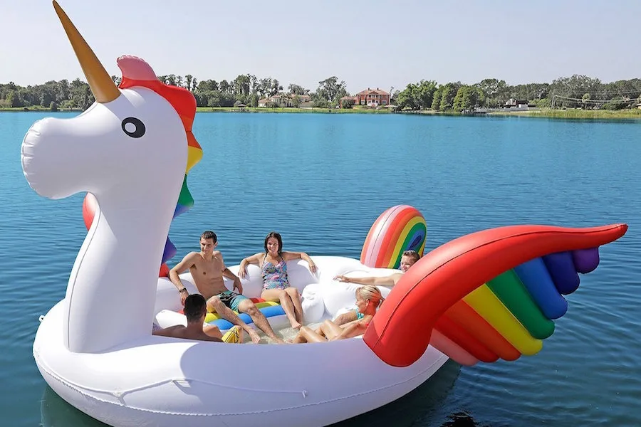 The giant rainbow unicorn pool float is more like a boat, holding 6 people