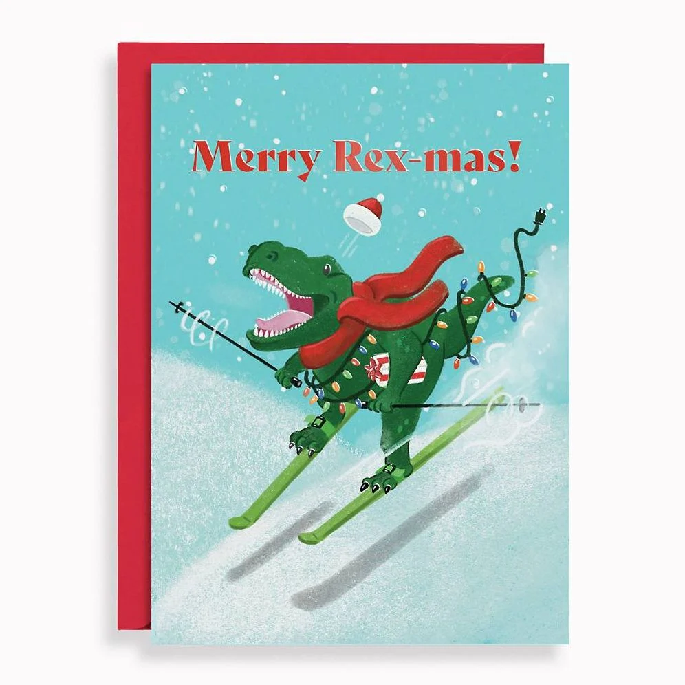 Merry Rex-mas holiday card with a T. rex skiing down a snowy hill