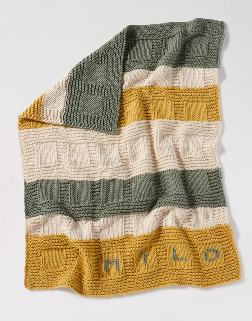 Happy Blanket knitting kit for a DIY baby gift via Wool & The Gang