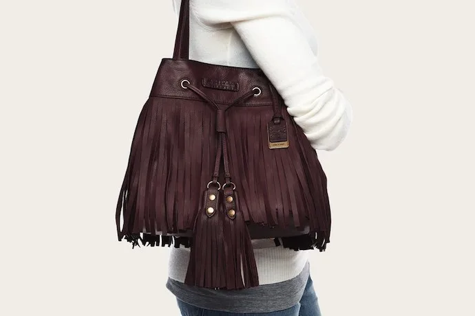 This fall we're seeing fringed handbags everywhere, like this plum bucket bag from Frye. Gorgeous.