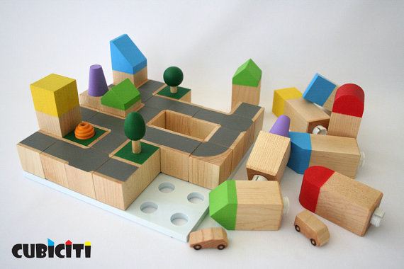 Natural handmade wooden block sets for kids, ready to become the city of their dreams