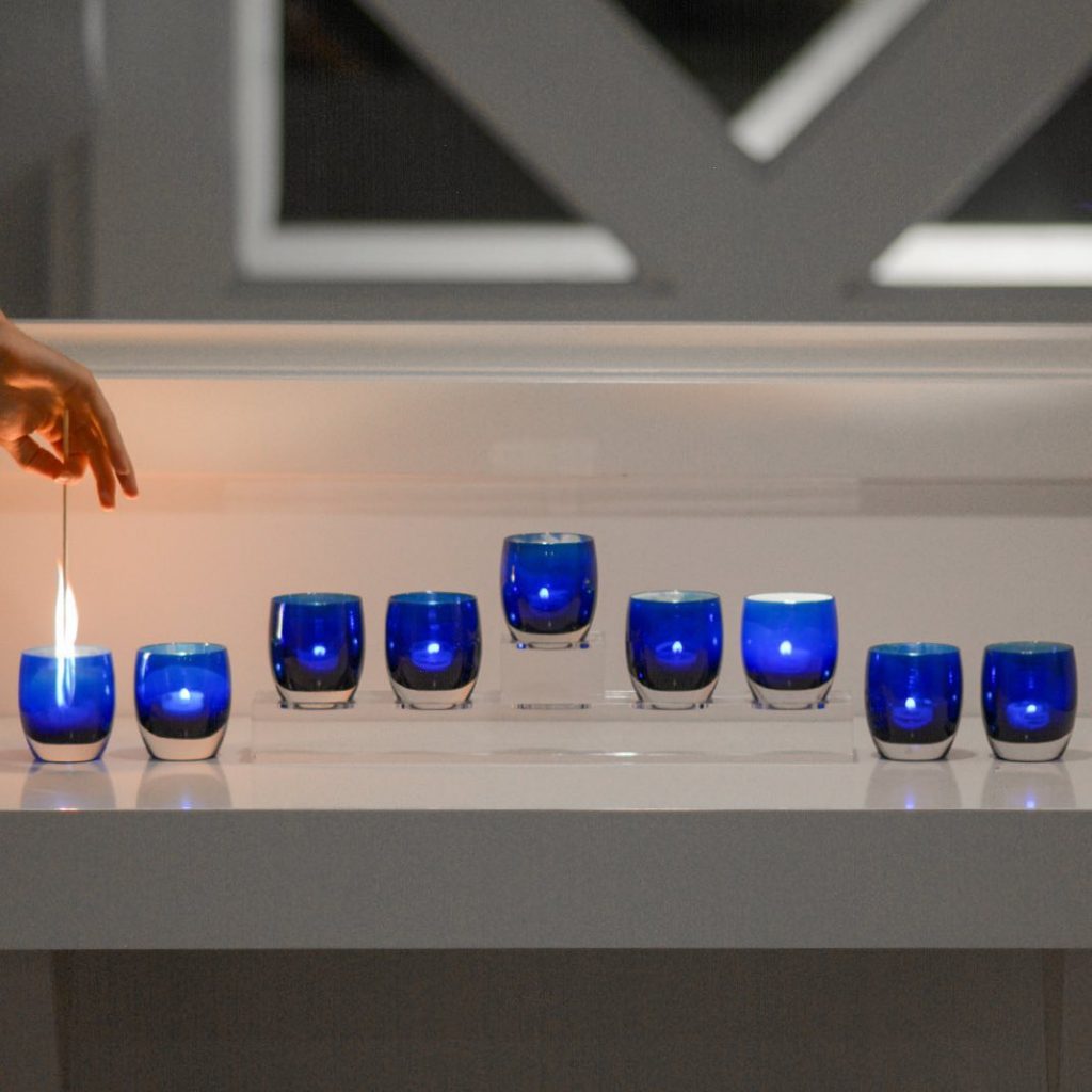 How to decorate with tea lights: Use candles to celebrate the holidays, like this minimalist menorah at glassybaby