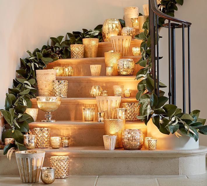 How to decorate with tea lights: Group votives on your stairs to prevent guests from entering off-limits areas of your home | via Pottery Barn