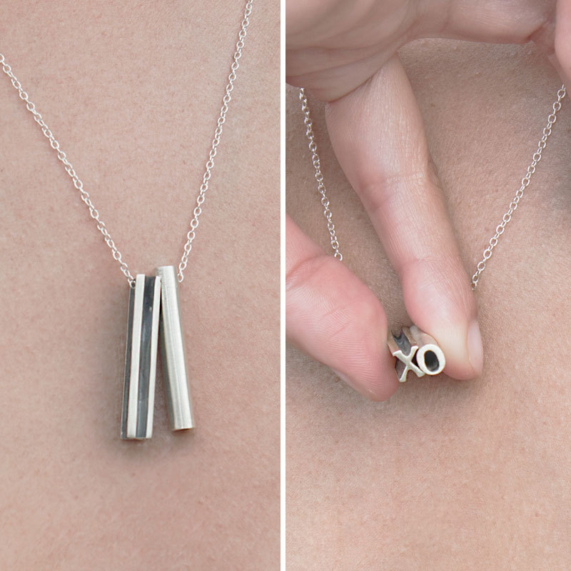 This custom hidden message necklace has two letters and a lot of love
