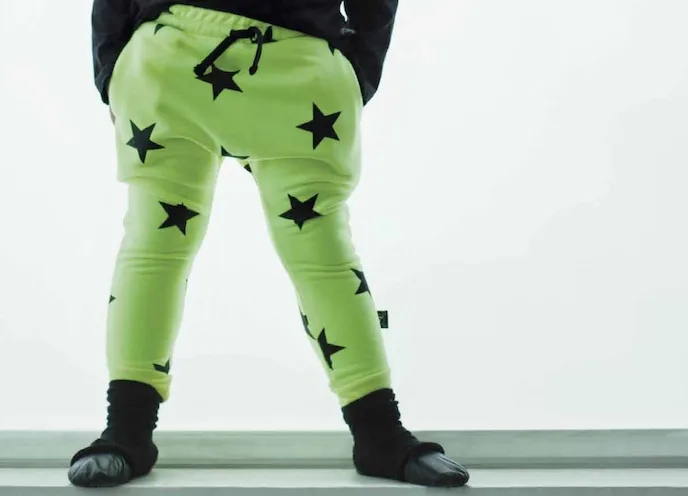 Cool Mom Picks' favorite funky print pants | Nununu green star leggings