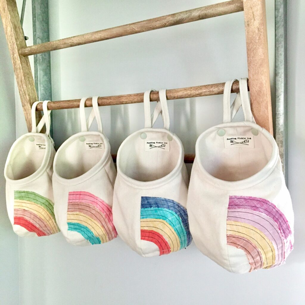 Hanging rainbow toy bags for playroom organization: Feeding Pickle on Etsy