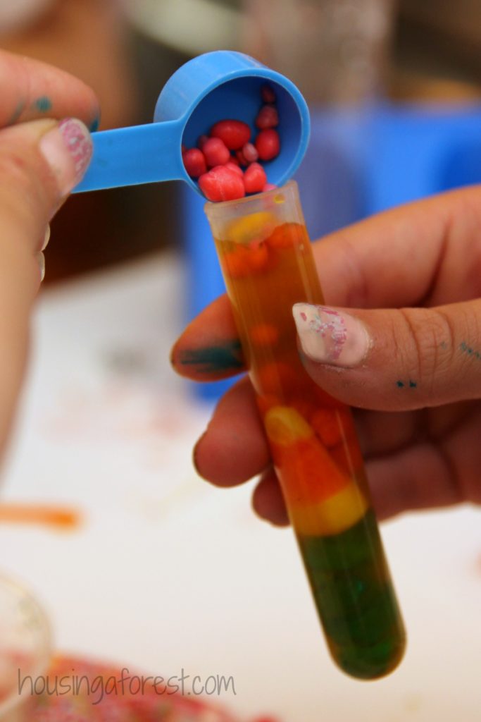 Science lessons using leftover Halloween candy: Make these candy "potions" from Housing a Forest