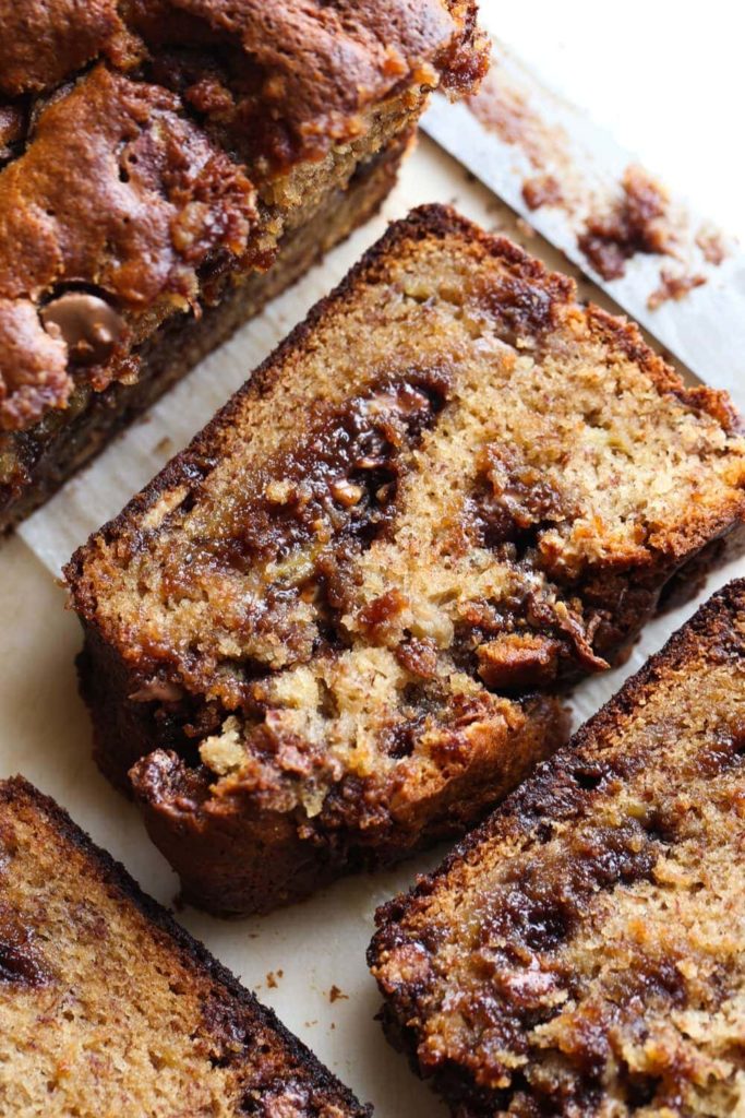 Recipes using leftover Halloween candy: Reeses Peanut Butter Banana Bread recipe from Cookies and Cups