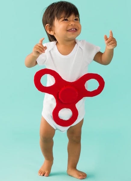 Easy baby Halloween costumes from onesies: DIY Fidget Spinner Halloween Costume by Brit + Co