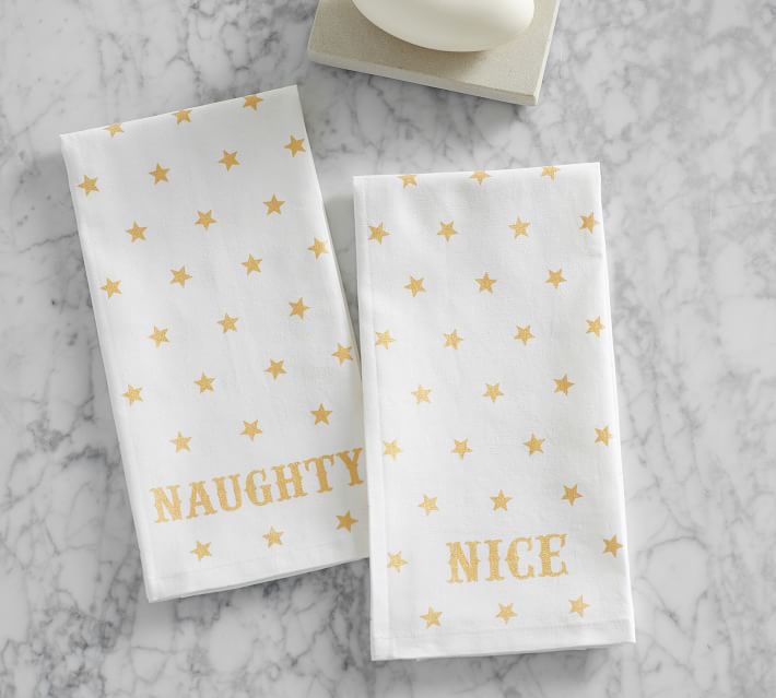 Funny hostess holiday gifts: The Emily & Meritt Naughty or Nice Guest Hand Towels at Pottery Barn