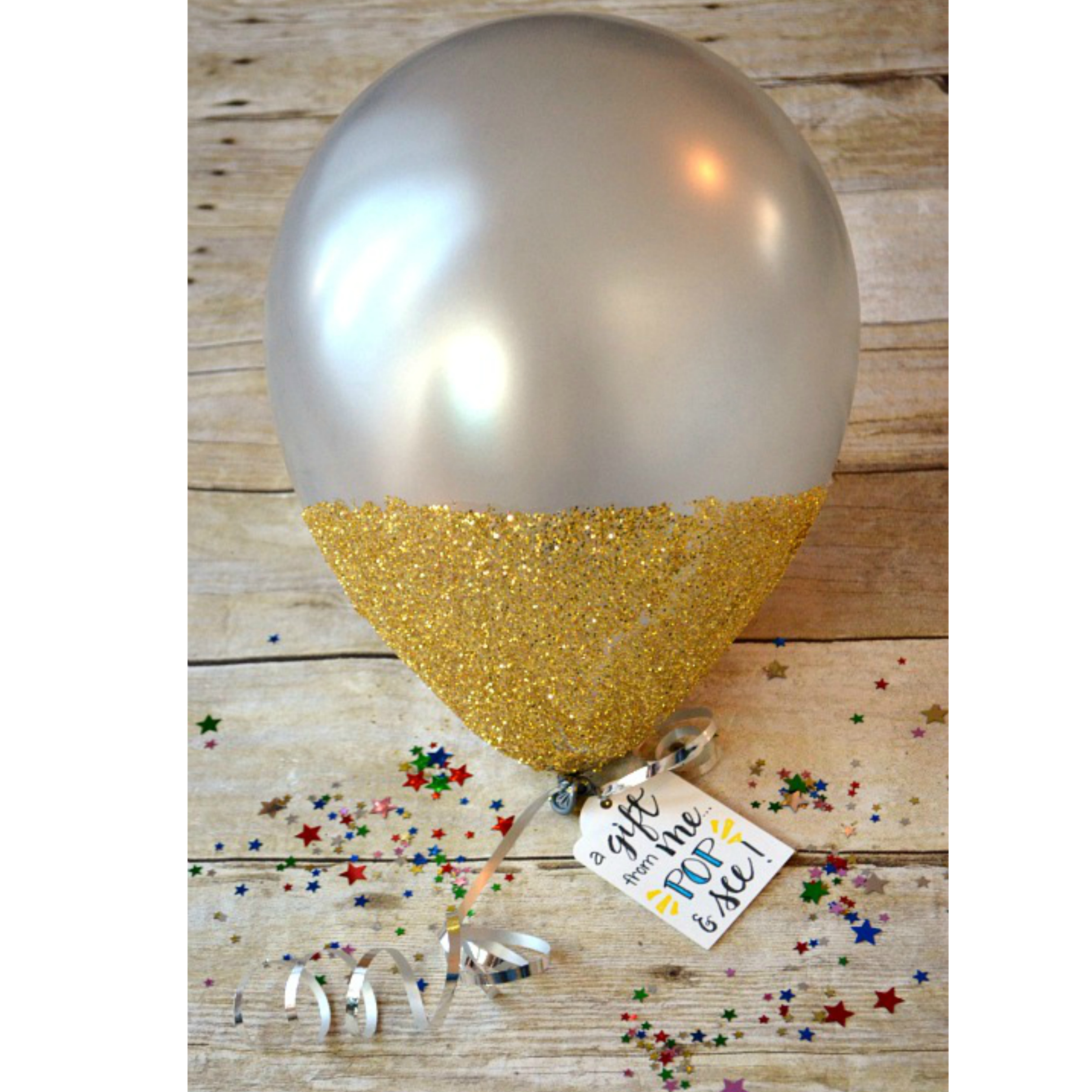 How to make gift cards more special: A great way to give a cash gift card is in a glitter dipped balloon like this one by dancers4life on One Artsy Mama.