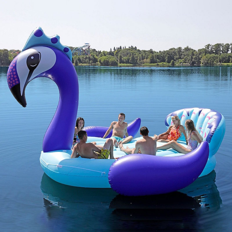 The giant peacock pool float is more like a boat, holding 6 people