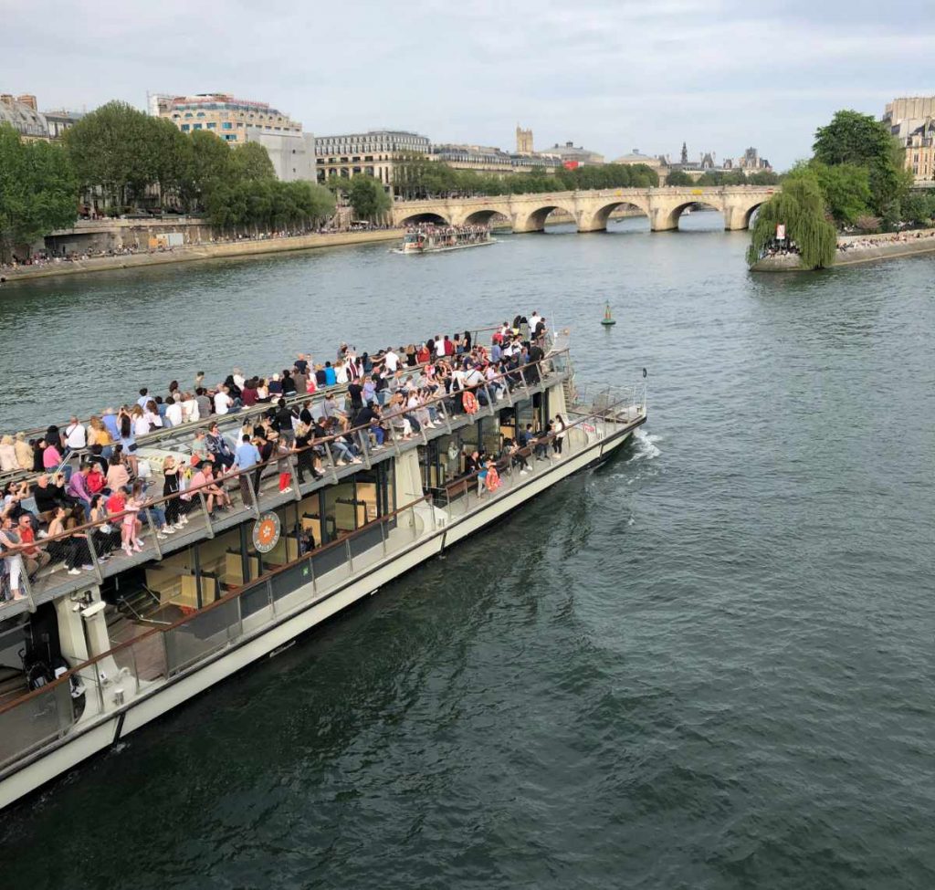 Paris travel with teens: Off the beaten path activities like a boat tour of architectural Paris