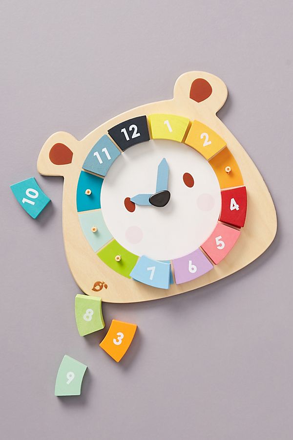 Best baby shower gifts under $30: Wooden bear clock toy | Cool Mom Picks baby shower gift guide 2023