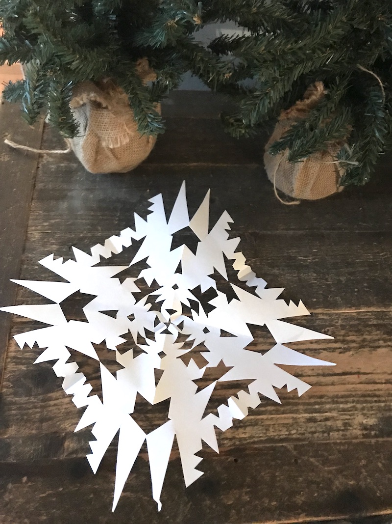 DIY Gratitude Garland tutorial: Step 1: Cut out snowflakes (or any other festive shape) for your garland. | Photo (c) Kate Etue for Cool Mom Picks