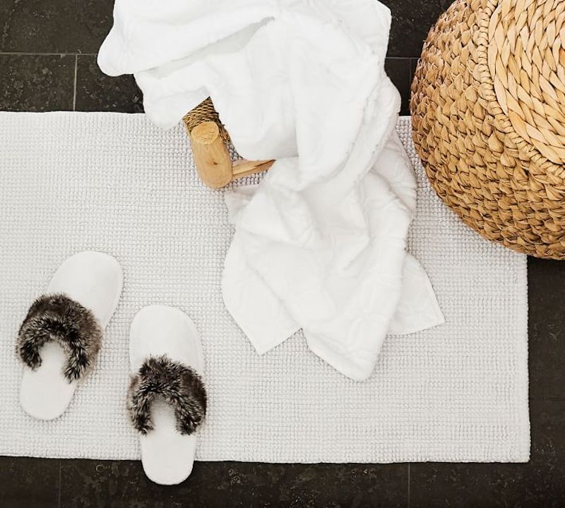 Self-care gifts for moms: Faux fur slippers for padding around the house, at Pottery Barn.
