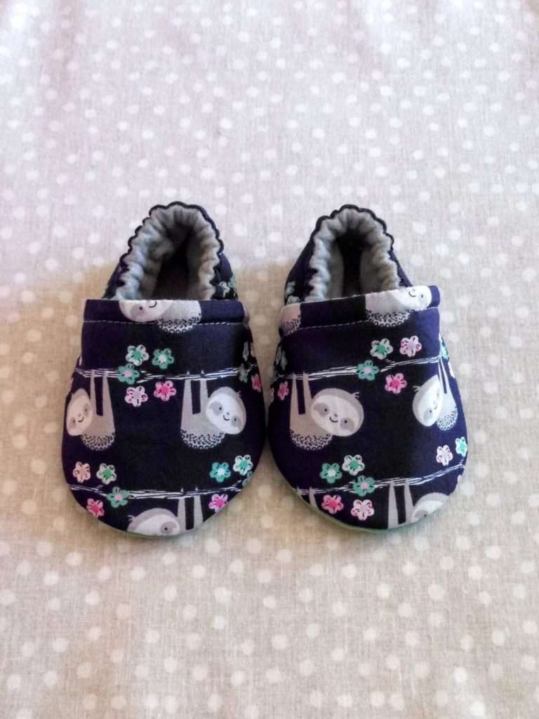 Best baby shower gifts under $15: Handmade sloth print baby shoes | Cool Mom Picks Baby Shower Gift Guide