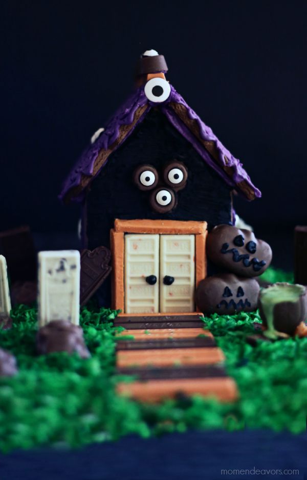 How to DIY a haunted gingerbread house: Our favorite tips |  We love the creative use of candies at this house by Mom Endeavors