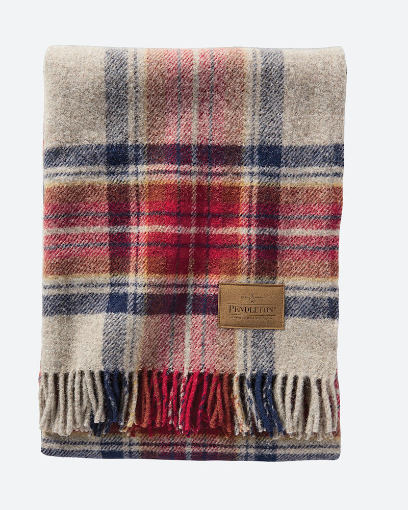 Gift ideas for The Crown fans: A wool throw in the Queen's favorite vintage dress Stewart tartan.