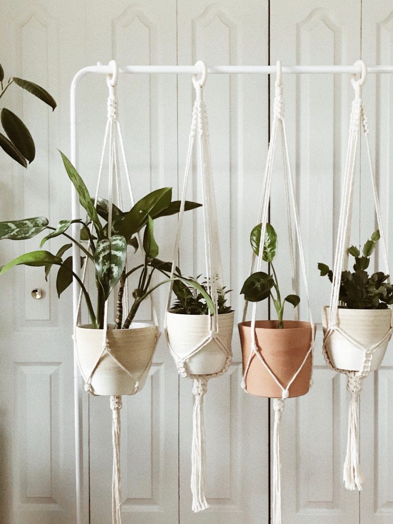 Stylish planters to zhuzh up your indoo living space: Macrame hanging planters at Breanna Lynn Designs