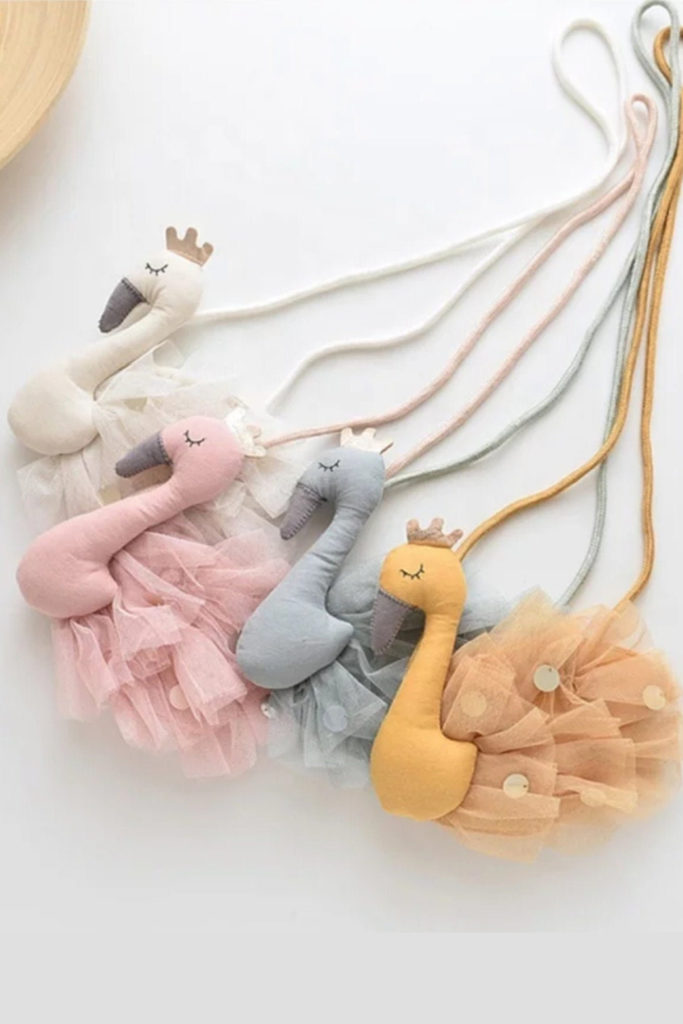 We're loving these adorable personalized flamingo (or cat, dog, or dino) purses by Aha Aha Moments