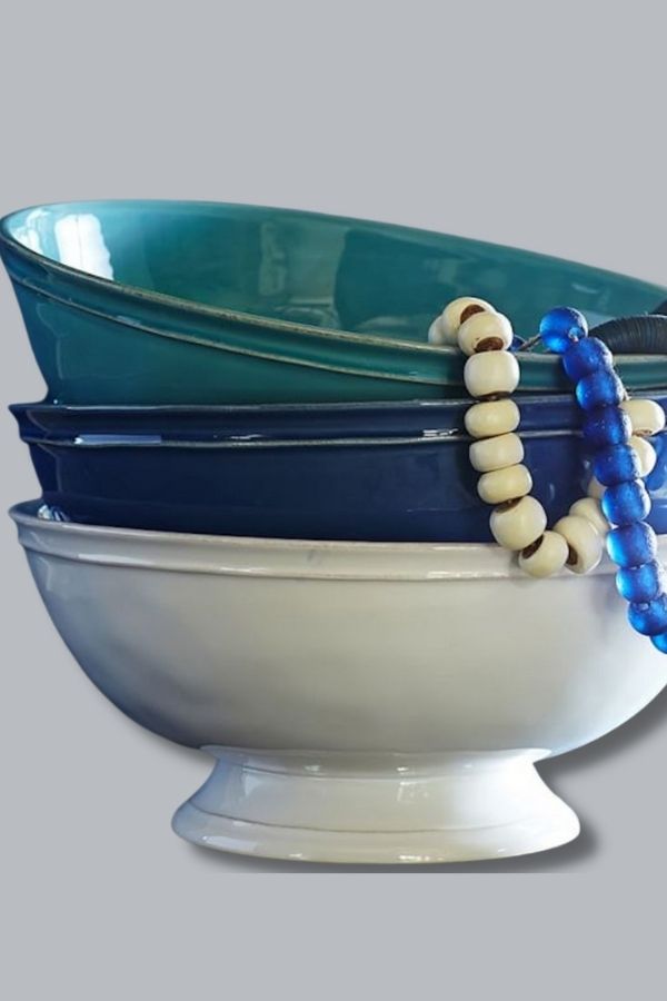 This pretty footed bowl from Pottery Barn can hold remotes or other small items you want to keep together