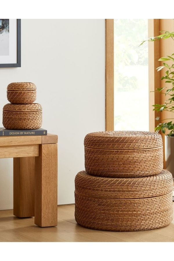 Use West Elm's storage baskets to hide messes in your family room