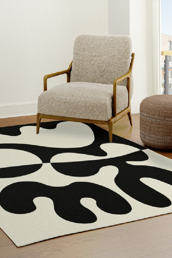 Easy, affordable ways to refresh a family room: Try an area rug, like this mid-century modern rug from Tony Magner Design on Society 6