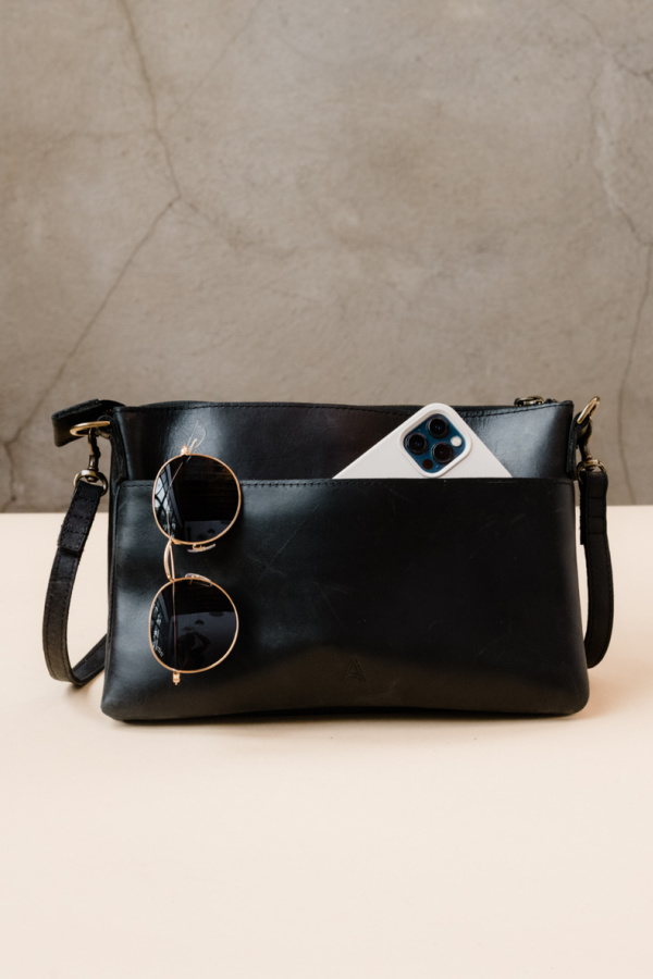 The sleek leather Martha crossbody bag is not only gorgeous (and on sale), it helps support women in need in a big way