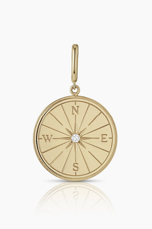 Symbolic jewelry gifts for grads: A keepsake gold and diamond compass cham from Gorjana